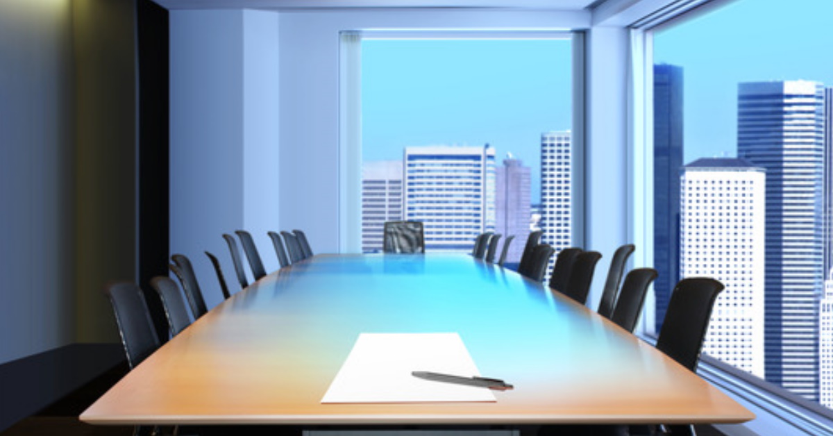 This is a picture of a corporate office with the downtown building skyline view from a window in the background. This office illustrates that safety consulting expertise is needed in both the field and the office.