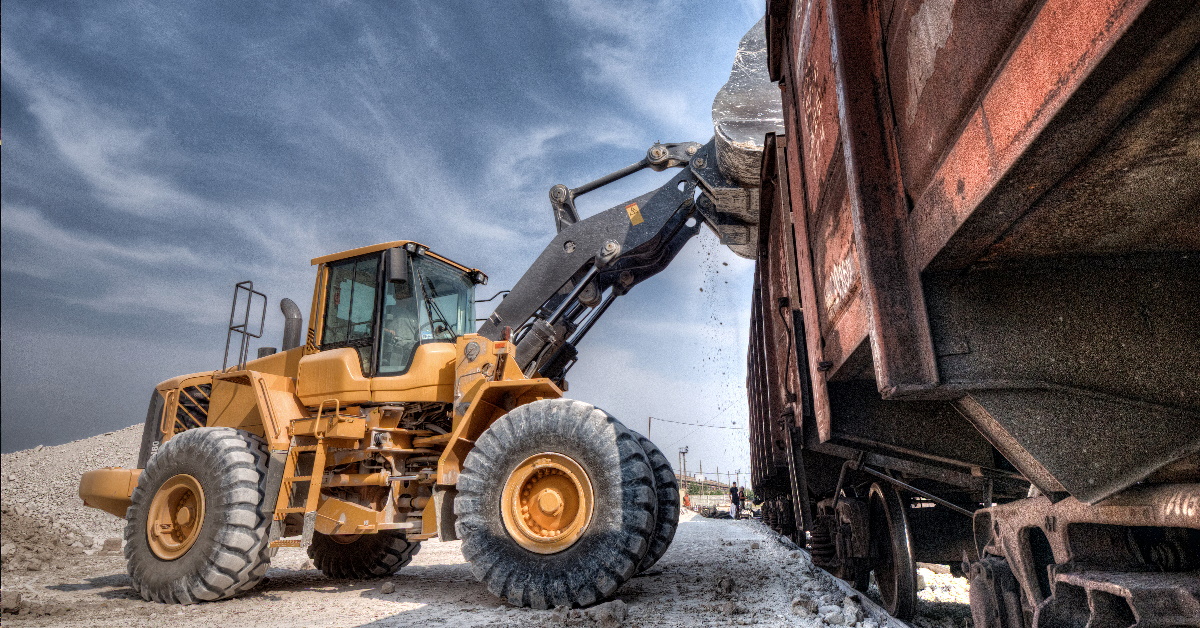 This is a picture of an loader lading a rail car. High risk operations sometimes require safety consultants so it important that clients understand their safety consultant beliefs and attitudes